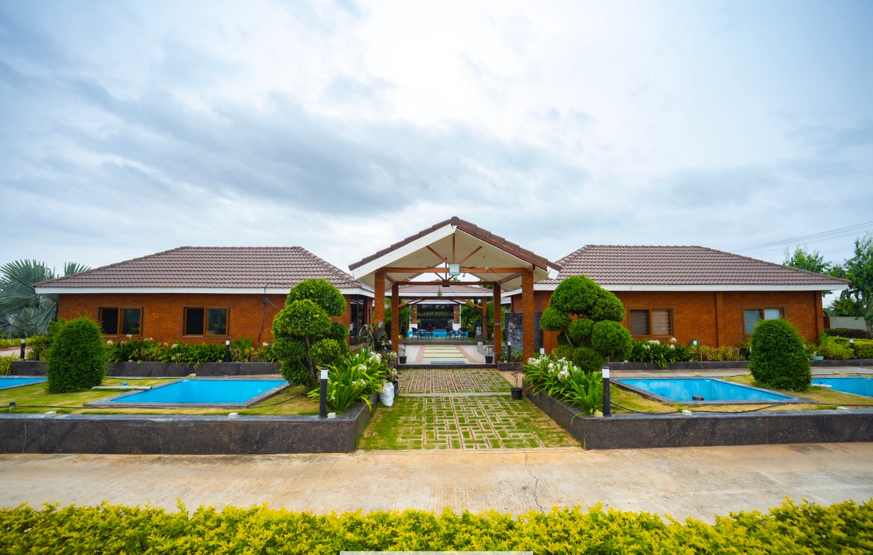 Front view of The Ranch Resorts cottages and pool